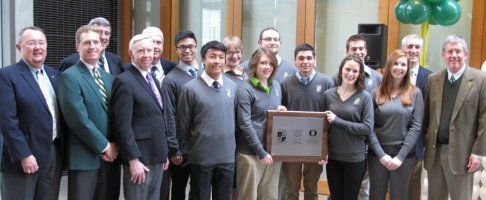 The UO's current Evans Scholars with representatives from the Evans S