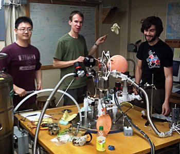 Three of the grad student co-authors in a UO lab