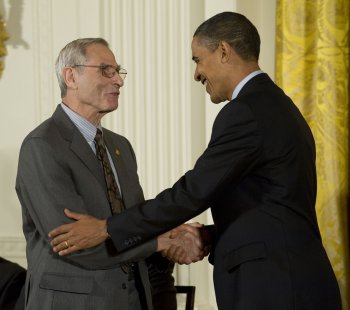 Photo of Michael Posner with President Obama