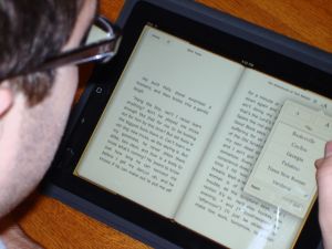 Image of student reading off an iPad