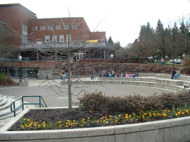 EMU at UO, long sloped sidewalks up and down into the building