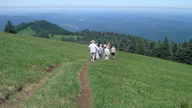 heading down the summit trail
