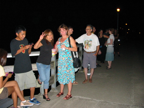 Vicky and other spectators, standing