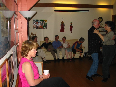 Dee watching Drew and Sue dance