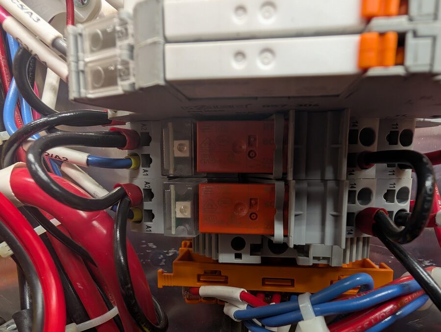 Photo 9: relay modules, wider view with A1/A2 coil terminals