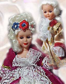 Two celluloid dolls dressed for the French court.