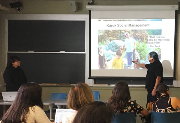 Photograph of Kari Norgaard and Ron Reed speaking at UC Berkeley in March 2019